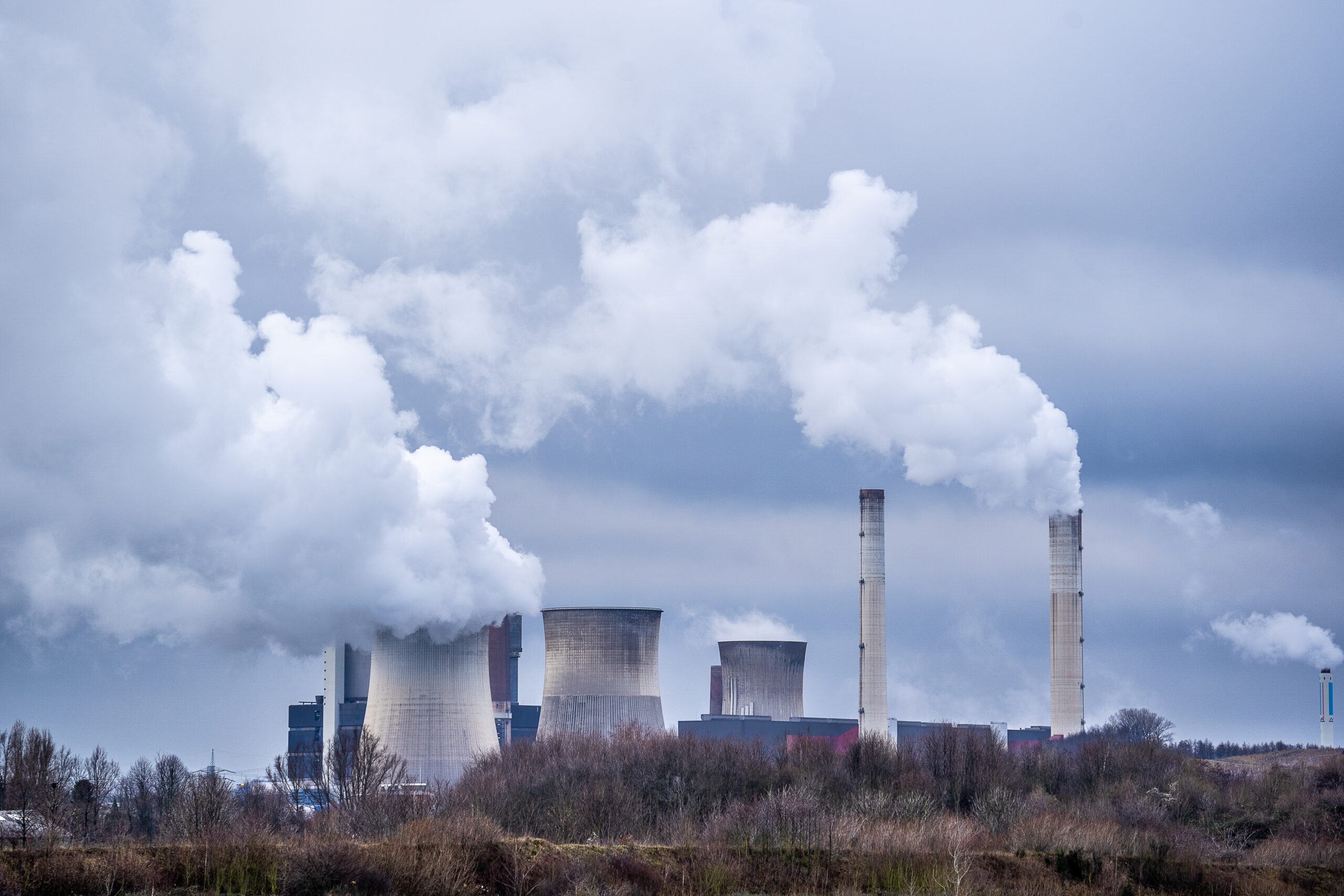 Wide angle shot of white smoke coming out of nuclear plants